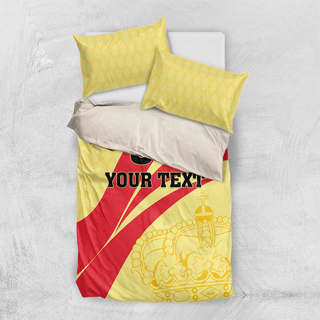 Yellow and red football bedding set with crown pattern, black 'YOUR TEXT' on duvet.