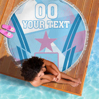 Blue round beach blanket with fringe, '00' header and star-and-crown design