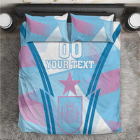 Football bedding set with blue and purple geometric print, star, and 'YOUR TEXT' on duvet