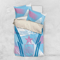 Football bedding set laid flat: blue and purple geometric print with star and 'YOUR TEXT'
