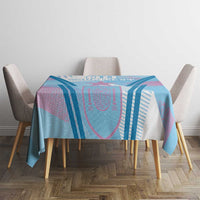 Blue football tablecloth on dining table with pink and dark blue stripe accents