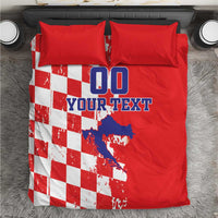 Red duvet and red pillows with white checkerboard panel and blue "DO YOUR TEXT" print