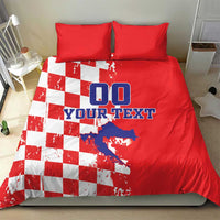 Red duvet bedding set with white checkerboard panel and blue "DO YOUR TEXT" text, with matching pillows