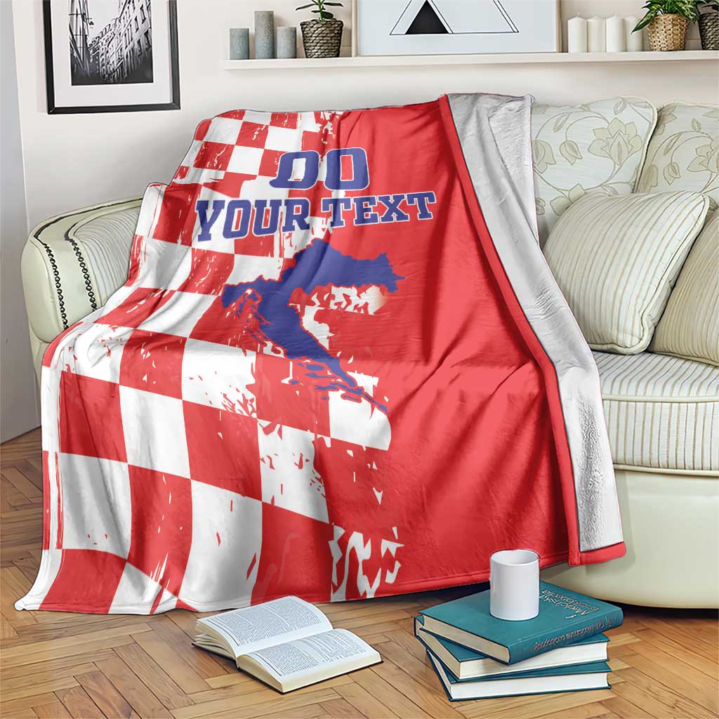 Red and white checkered blanket covering a sofa, with blue “00” and “YOUR TEXT”