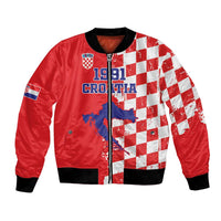 Red bomber jacket with white checkered panels, front zipper, ribbed cuffs and hem