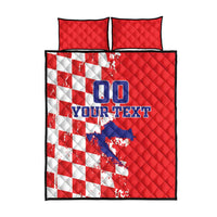 Red quilt bed set with white checker pattern, blue graphic center, and matching pillowcases