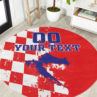 Round red checkerboard map rug close-up with blue map and YOUR TEXT letters
