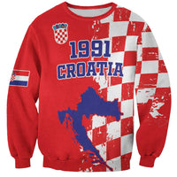 Red unisex sweatshirt with 1991 Croatia print, map, and grunge checkerboard sleeves