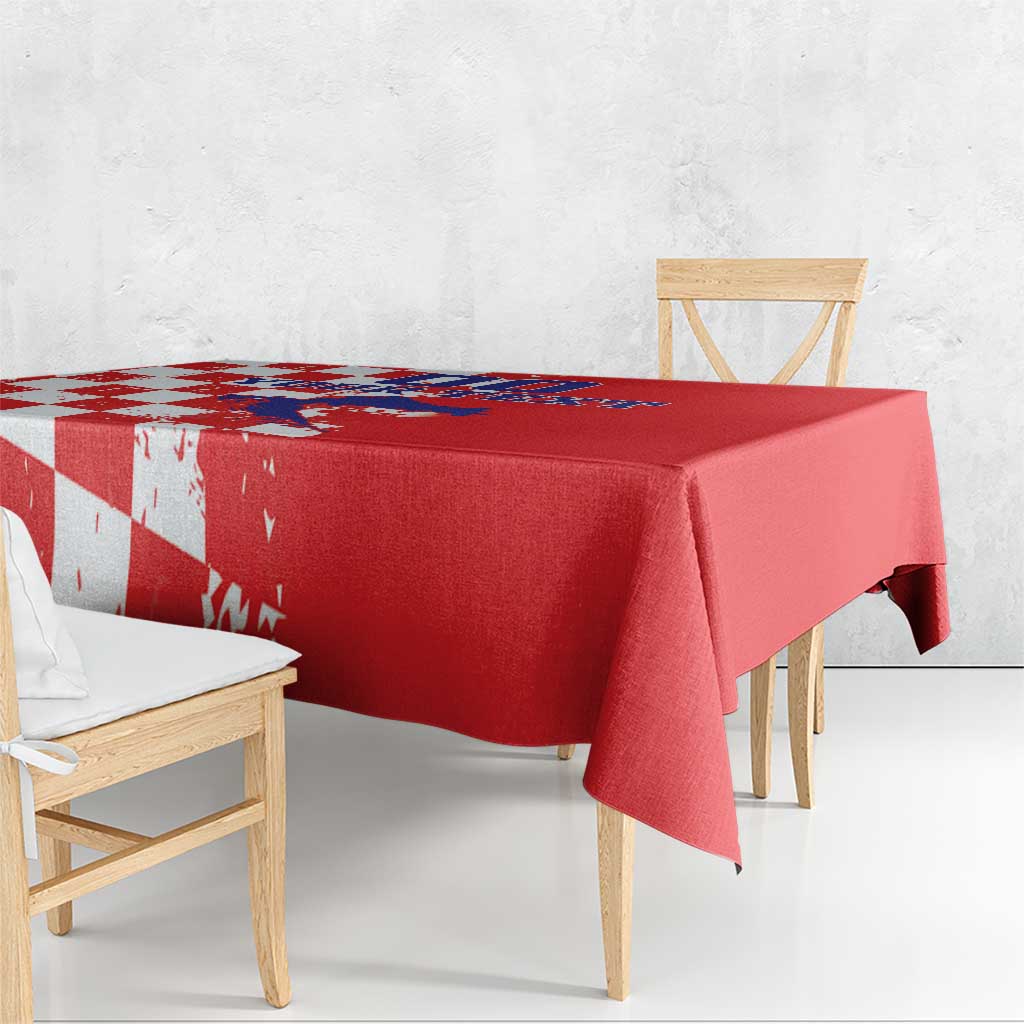 Red rectangular tablecloth draped over table with grunge checkerboard and map