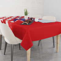Red tablecloth covering dining table with grunge checkerboard and map print