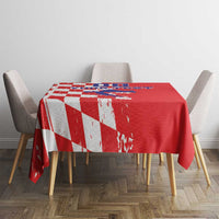 Red grunge checkerboard tablecloth with map graphic, shown on square table