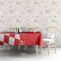 Red tablecloth featuring grunge checkerboard and map graphic on dining table