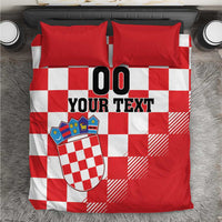 Red and white checkered bedding set with crest and bold “00 YOUR TEXT” print