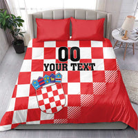 Red and white checkered duvet cover set with two red pillows and crest, “00 YOUR TEXT”