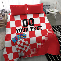 Red and white checkered bedding set with crest shield and “00 YOUR TEXT” text on duvet