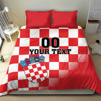 Red and white checkered duvet cover with two red pillows, crest shield and “00 YOUR TEXT”