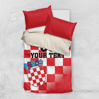 Red and white checkered bedding set with crest shield, “00 YOUR TEXT” on duvet