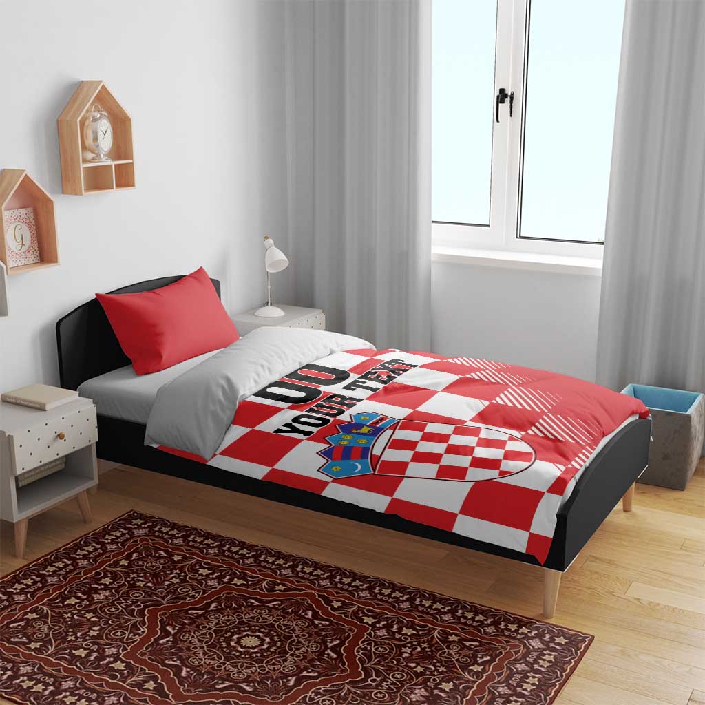 Red and white checkered bedding set with crest graphic and “00 YOUR TEXT” on duvet