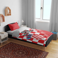 Red and white checkered bedding set with crest graphic and “00 YOUR TEXT” on duvet