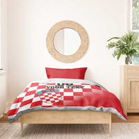 Red and white checkered duvet with crest shield, “00 YOUR TEXT” print, red pillow
