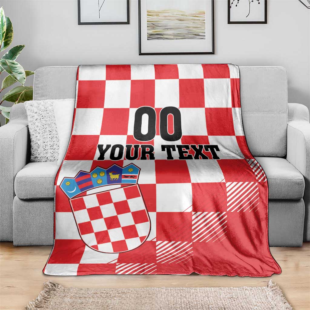 Croatia checkerboard custom blanket on gray sofa, red and white checks, coat of arms, “00 YOUR TEXT”
