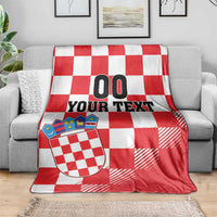 Croatia checkerboard custom blanket on gray sofa, red and white checks, coat of arms, “00 YOUR TEXT”