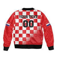 Red checkered bomber jacket with large 00 graphic and black ribbed hem