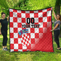 Red and white checkered quilt with coat of arms patch and bold 'YOUR TEXT' design