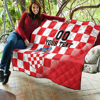 Red and white checkerboard quilt with coat of arms emblem and custom 'YOUR TEXT' text