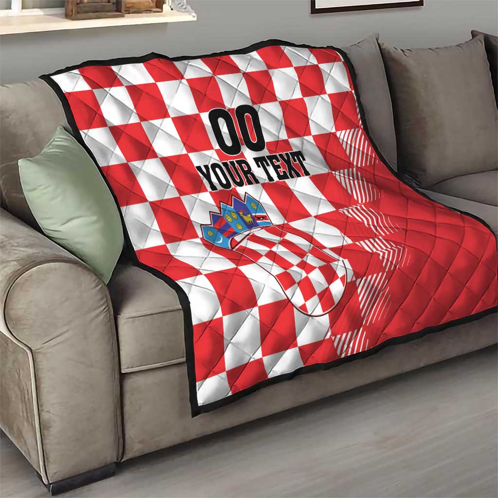 Red and white checkerboard quilt blanket with coat of arms patch and black 'YOUR TEXT' design