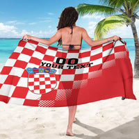 Custom red/white checkerboard sarong with coat of arms shield and 'YOUR TEXT' print