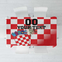 Red and white checkerboard tablecloth with large coat of arms panel and blank text area