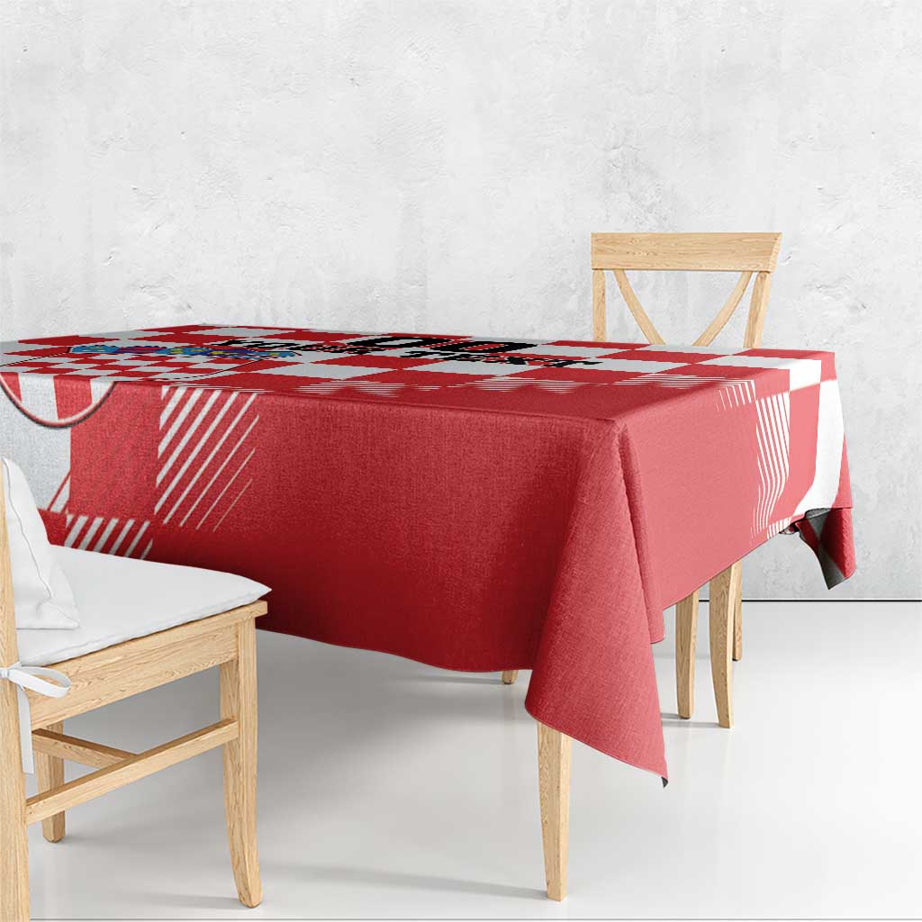 Red and white checkerboard tablecloth draped over dining table corner