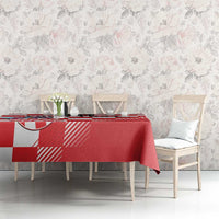 Red and white checkerboard tablecloth on long dining table with centered coat of arms
