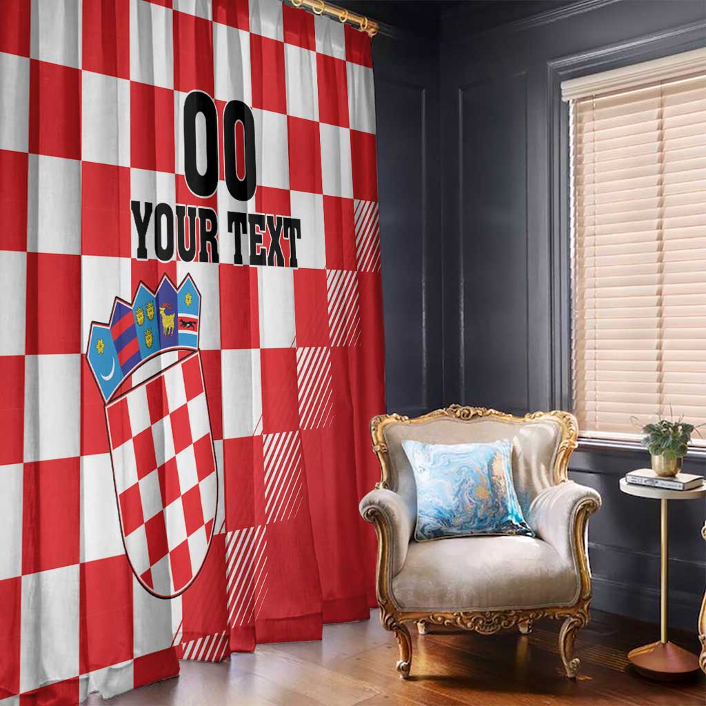 Red and white check window curtain with coat of arms and custom text, shown near chair