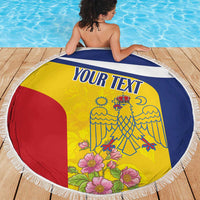 Round beach blanket with white fringe, yellow red blue flag artwork with flowers and 'YOUR TEXT'.