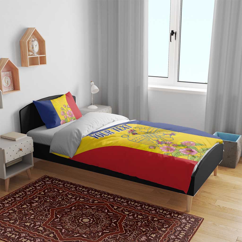 Flag-colored duvet cover and pillow set on bed, floral crest center panel and red trim