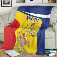 Personalized Romania pelican blanket with custom text, yellow blue red, over cream sofa arm