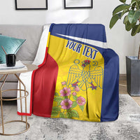 Personalized Romania pelican blanket with custom text, yellow blue red, on living room sofa