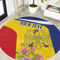 Personalized round carpet with yellow center, blue border, red curved panel, floral crest