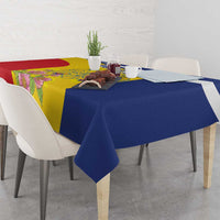 Tablecloth with dark blue skirt and yellow center panel featuring flowers, red corner