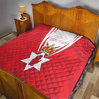 Red quilt blanket with Northern Ireland crest and 'YOUR TEXT' over bed, diamond quilt pattern