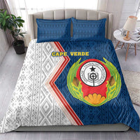 Blue and white duvet with emblem and geometric side panels, 2 blue pillows.