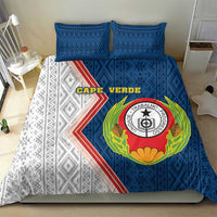 Blue and white duvet with circular emblem and diagonal stripe motif, 2 pillows.