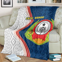 Cape Verde-themed blanket draped on armchair with blue chevrons and crest patch
