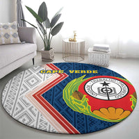 Round area rug showing coat of arms emblem with corn and flower graphics in blue pattern
