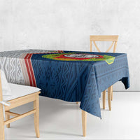 Blue rectangular tablecloth with Cape Verde emblem and patterned center, on dining set