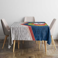 Blue tablecloth with Cape Verde emblem panel and geometric side stripe, on dining table
