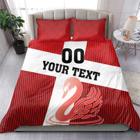 Red striped duvet cover with white banner reading “YOUR TEXT”, “00”, and swan print; two pillows