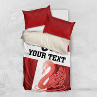 Red striped duvet cover with “YOUR TEXT” and swan graphic on white panel; two red pillow shams